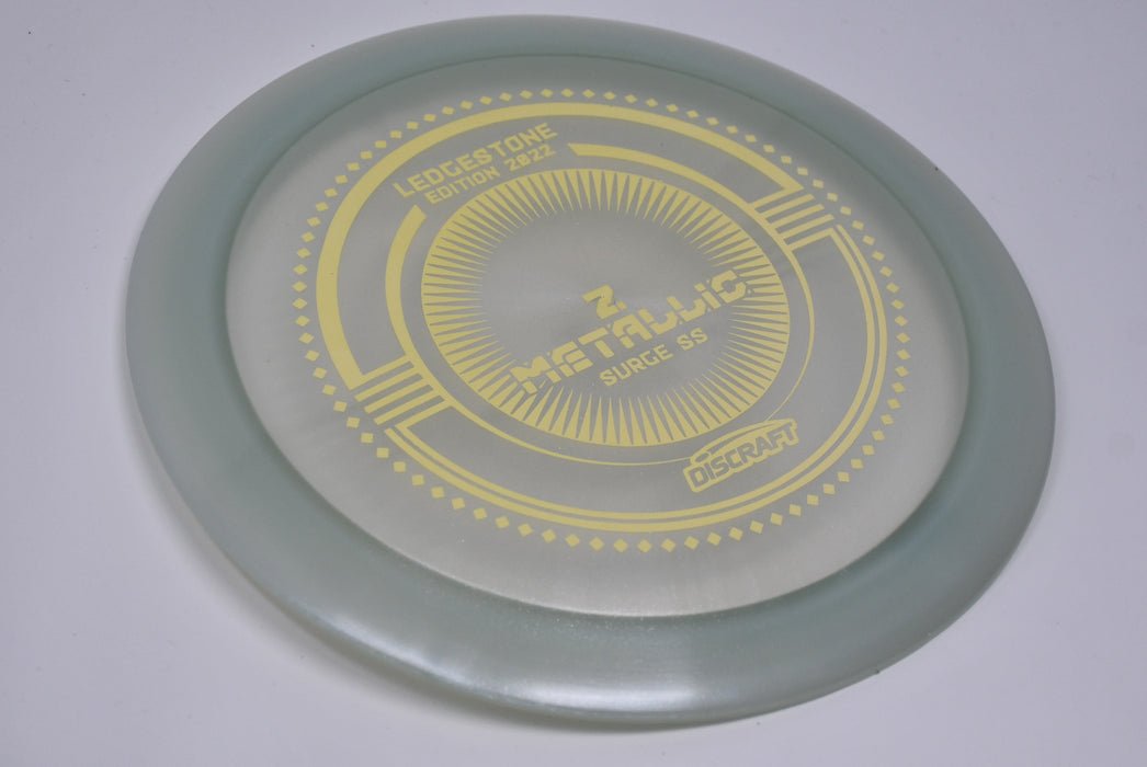 Buy Gray Discraft LE Z Metallic Surge SS Ledgestone 2022 Distance Driver Disc Golf Disc (Frisbee Golf Disc) at Skybreed Discs Online Store