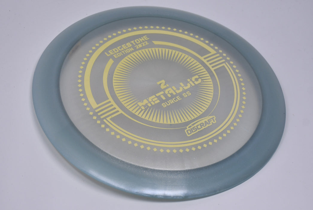 Buy Gray Discraft LE Z Metallic Surge SS Ledgestone 2022 Distance Driver Disc Golf Disc (Frisbee Golf Disc) at Skybreed Discs Online Store